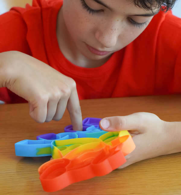 Child playing with fidget toy