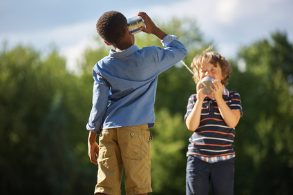 Children communicating with tin cans