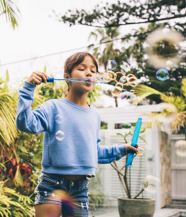 Girl blowing bubbles